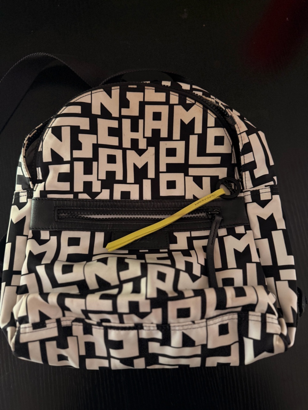 Longchamp Black and White Logo Print Backpack with Yellow Zipper Pull